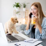 woman and pet working at desk
