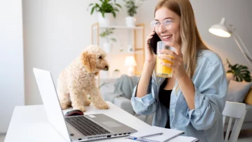 woman and pet working at desk