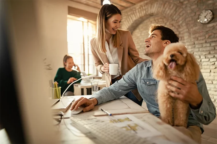 Happy businessman with a poodle